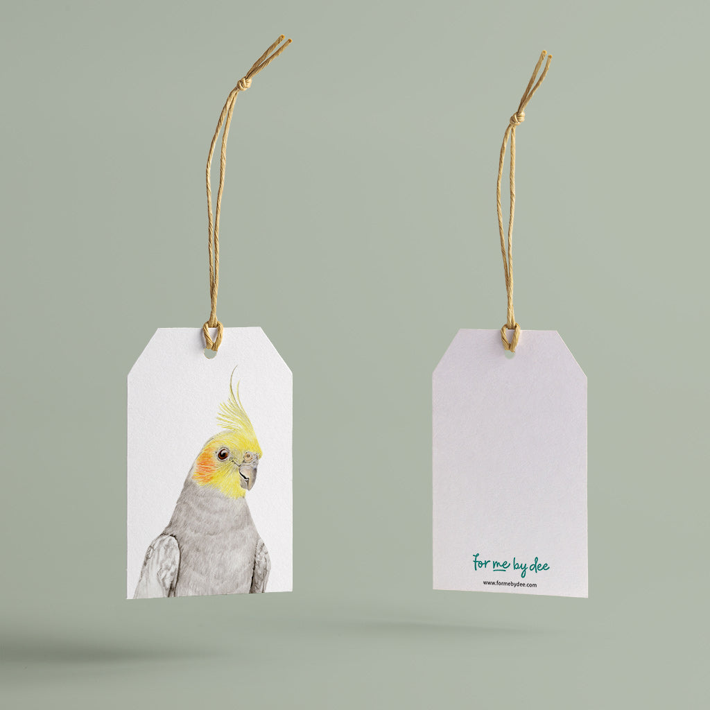 cockatiel australian bird gift tag with twine string on green background