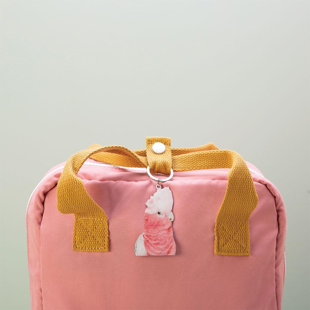 galah australian bird watercolour artwork enamel keychain on pink bag with mustard handles