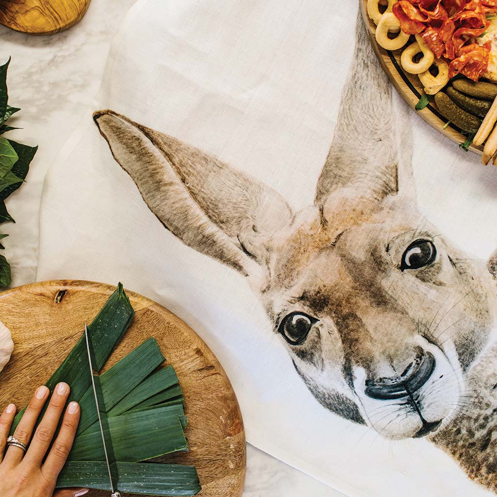 white linen tea towel with kangaroo watercolour artwork in kitchen with food