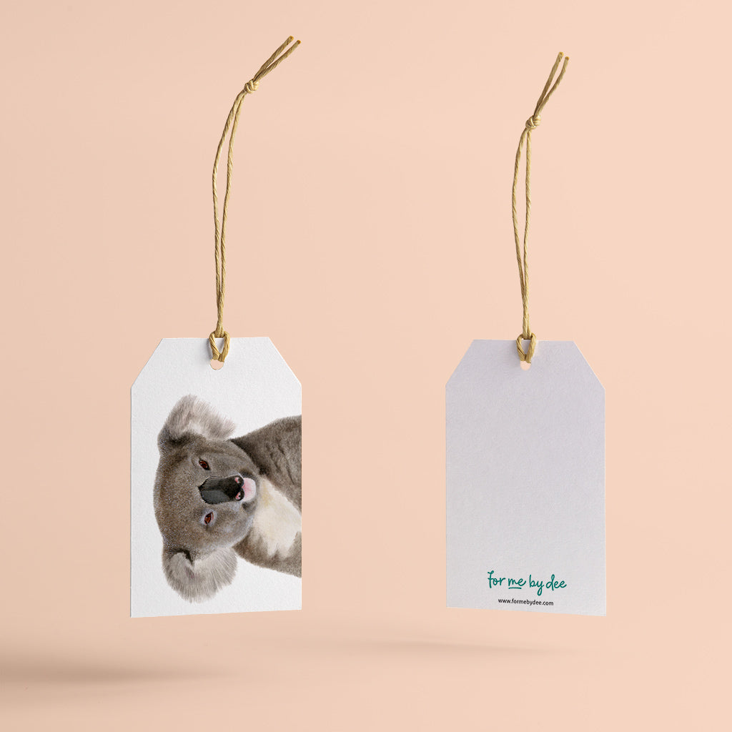 koala australian animal gift tag with twine string on pink background