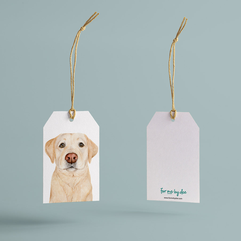labrador retriever dog gift tag with twine string on blue background
