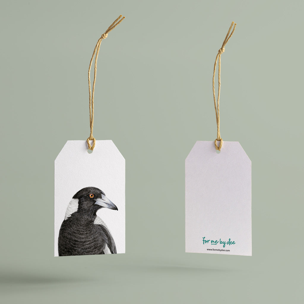 magpie australian bird gift tag with twine string on green background