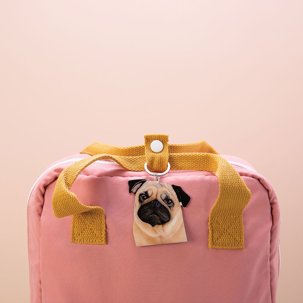 fawn pug dog watercolour artwork enamel keychain on pink bag with mustard handles