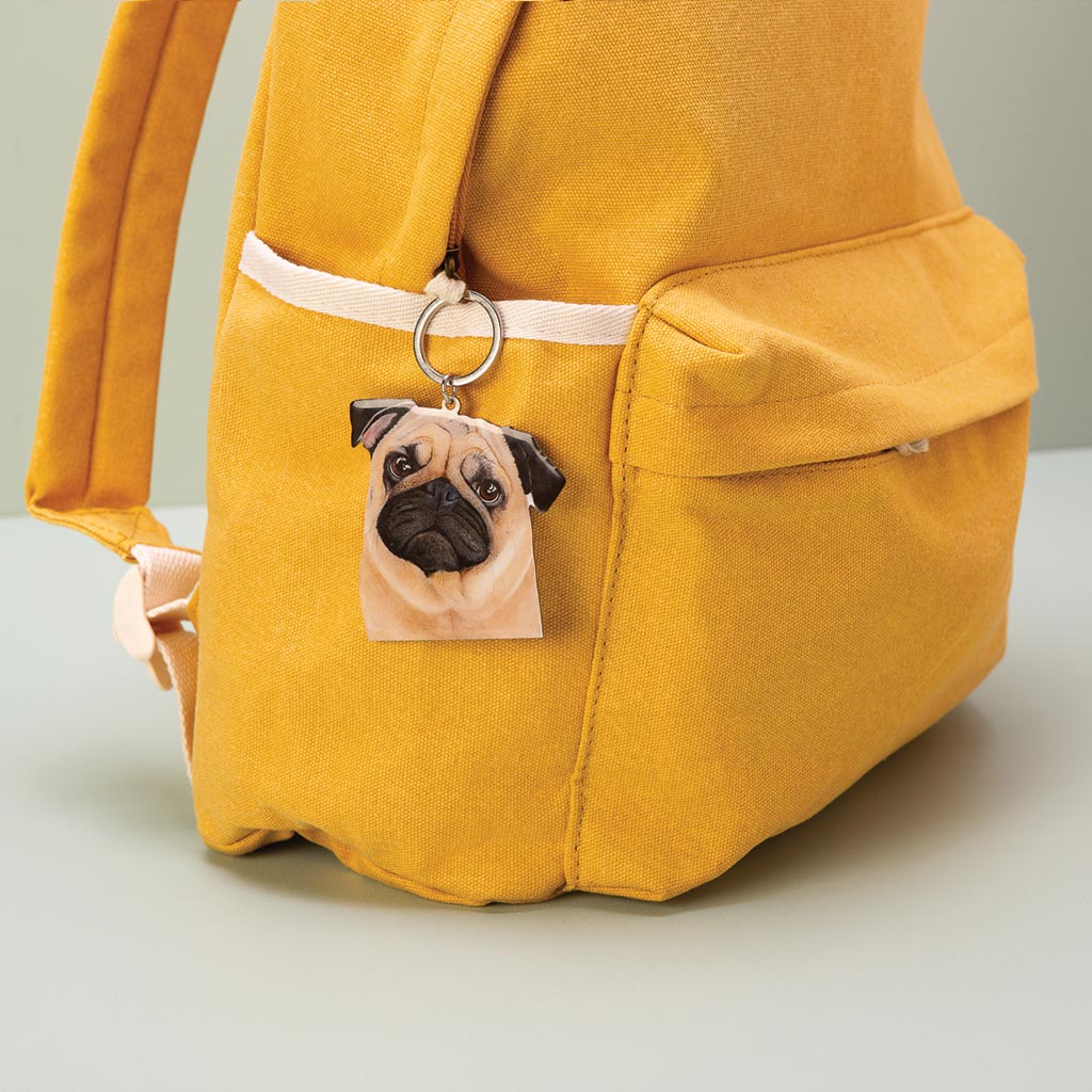 fawn pug dog watercolour artwork enamel keychain on yellow canvas backpack