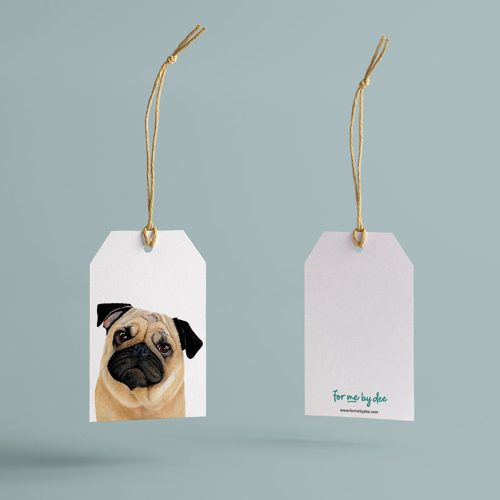 fawn pug dog gift tag with twine string on blue background