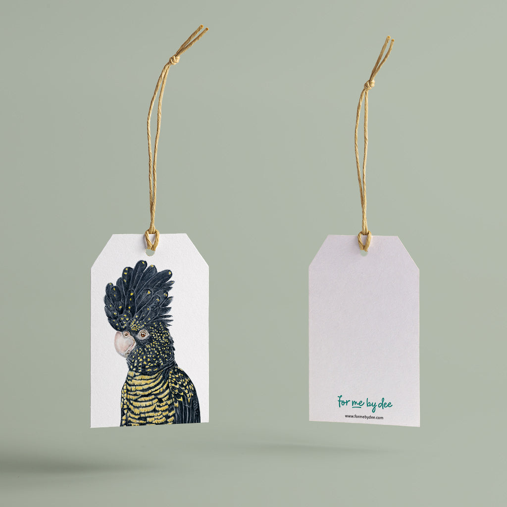 red-tailed black cockatoo australian bird gift tag with twine string on green background