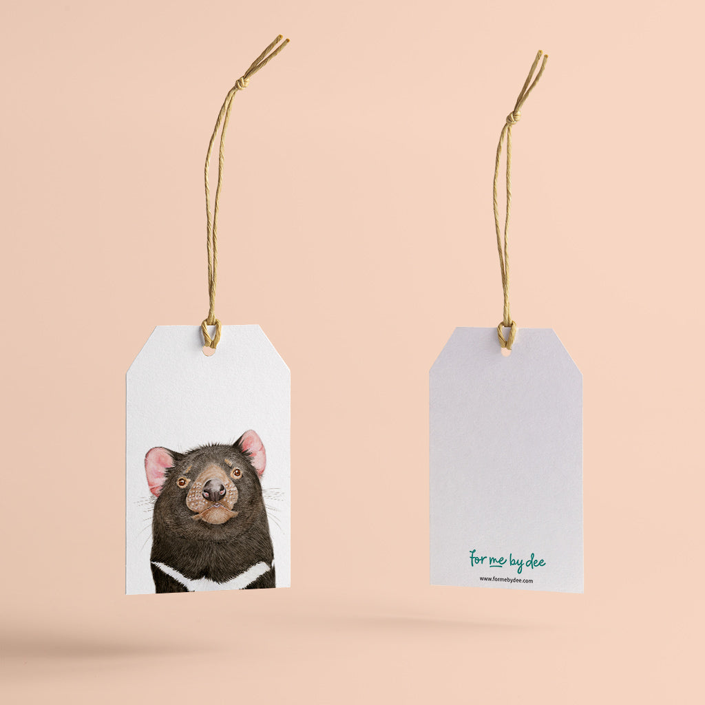tasmanian devil australian animal gift tag with twine string on pink background