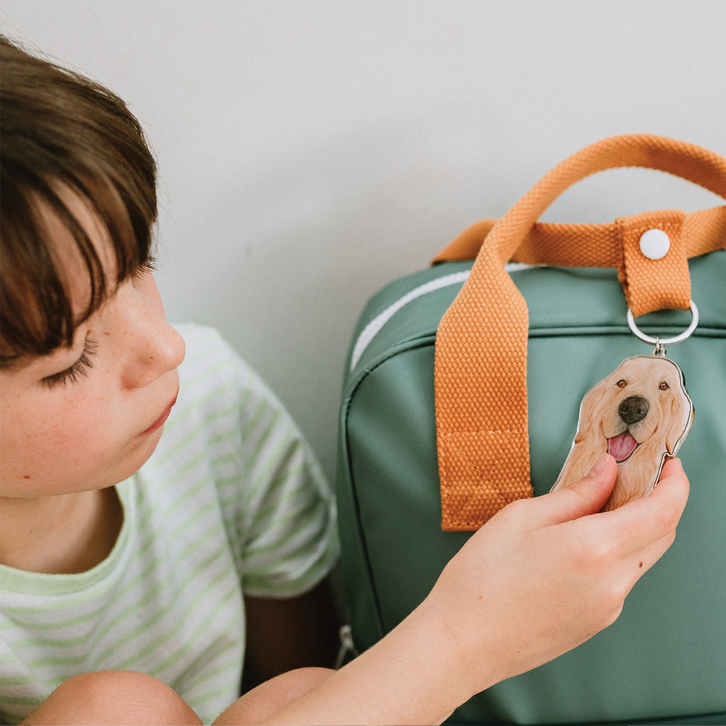 golden retriever girl green school bag backpack