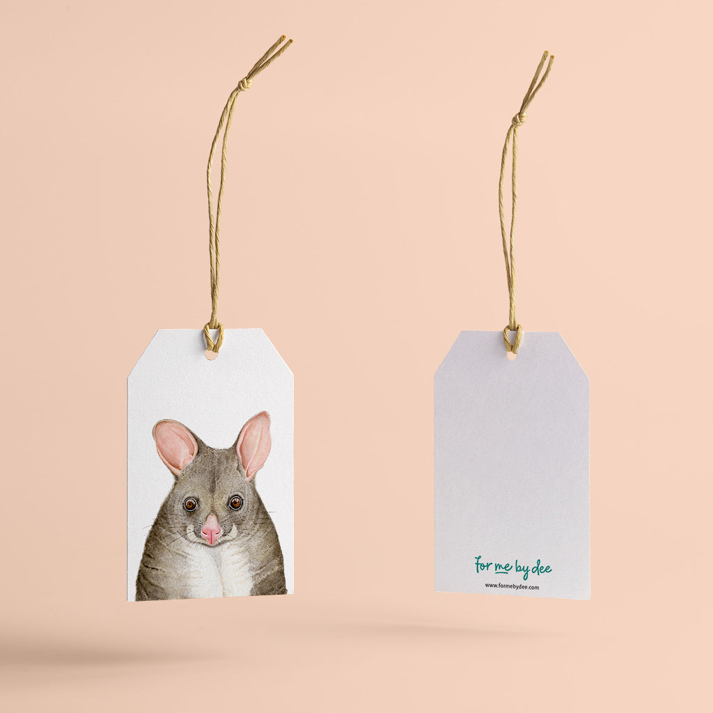 possum australian animal gift tag with twine string on pink background