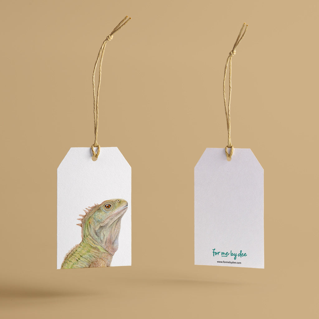 tuatara new zealand lizard painted on gift tag with twine string on mustard background